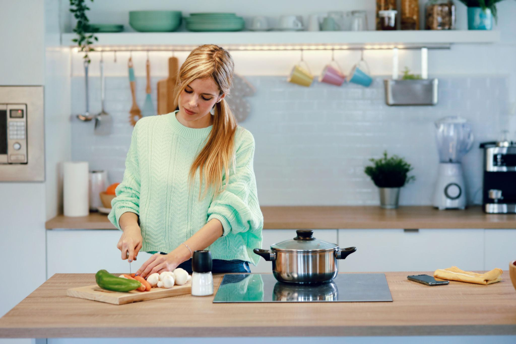 Beginner learning essential cooking tips in a home kitchen