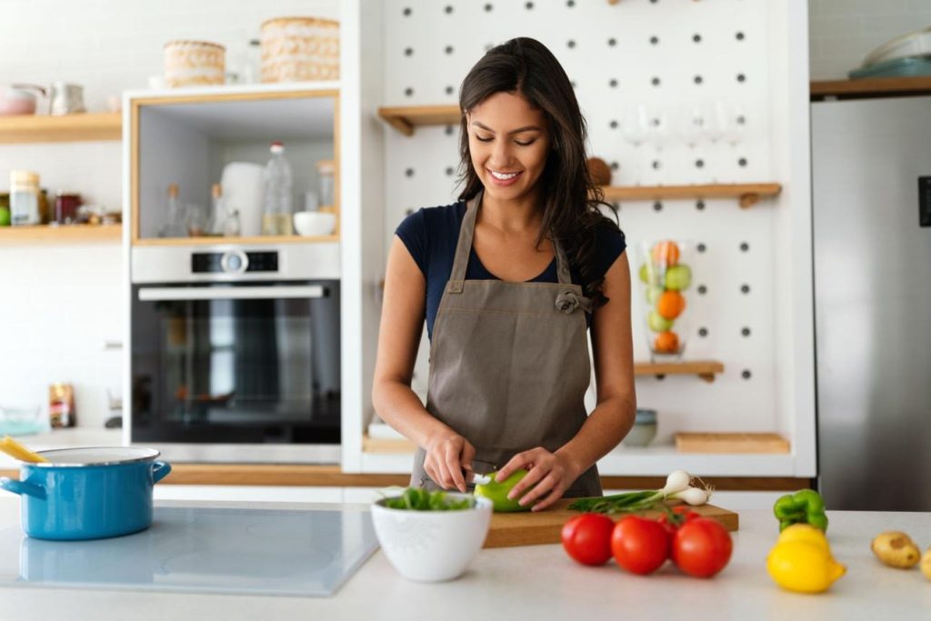 Beginner confidently cooking a healthy homemade meal