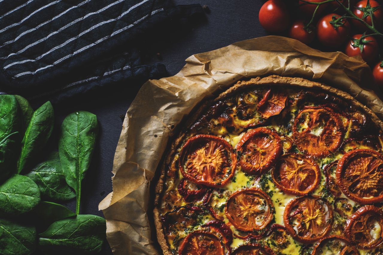 journey Delicious rustic quiche topped with tomatoes, ideal for a healthy and tasty meal.